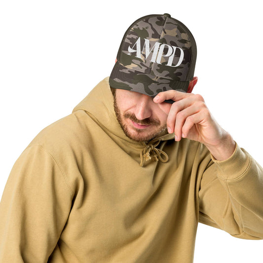 AMPD Embroidered Camouflage Trucker Hat worn by a man in a hoodie, showcasing its stylish design