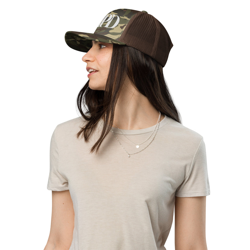 AMPD Embroidered Camouflage Trucker Hat worn by a model in casual attire showing side view