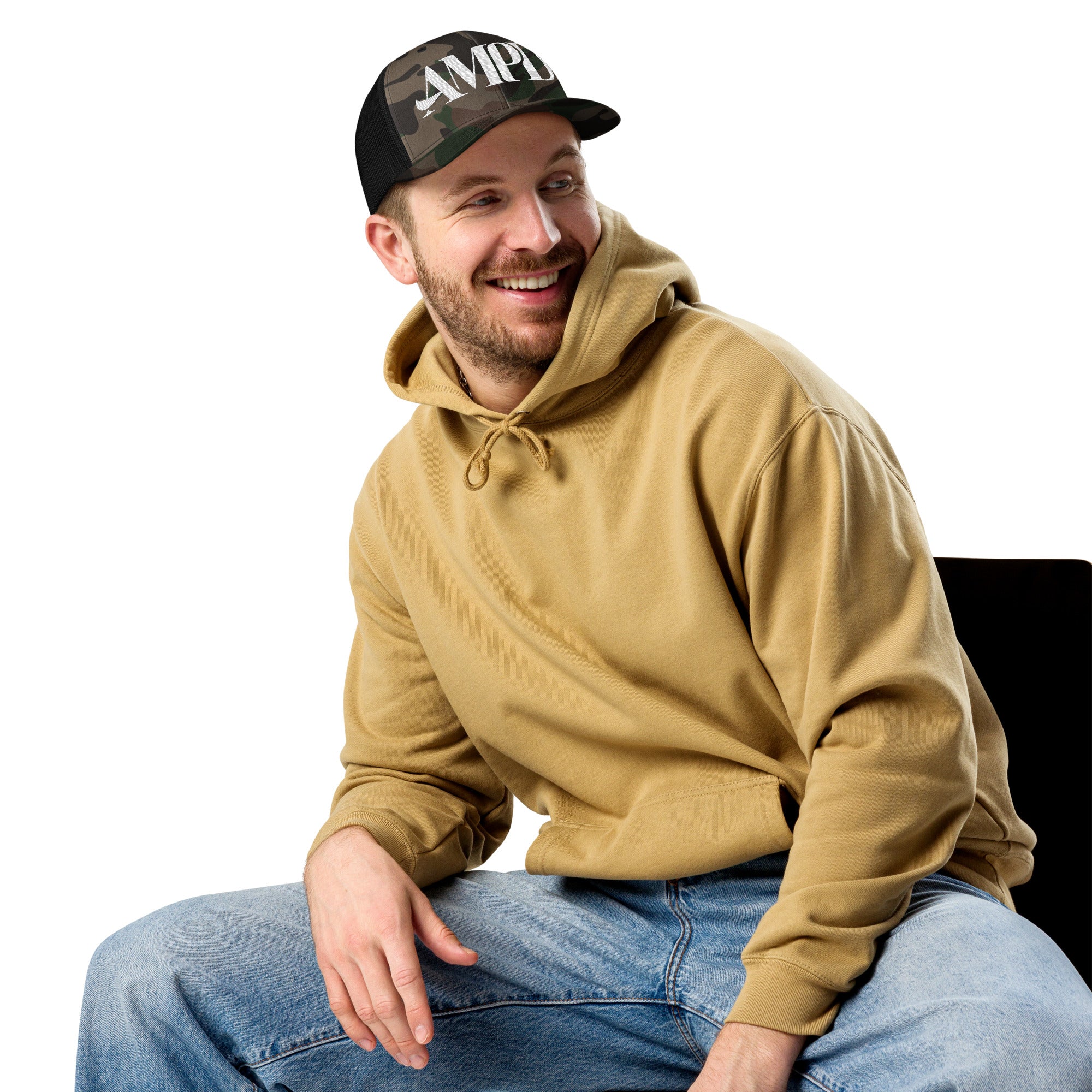 AMPD Embroidered Camouflage Trucker Hat worn by a smiling man in a beige hoodie