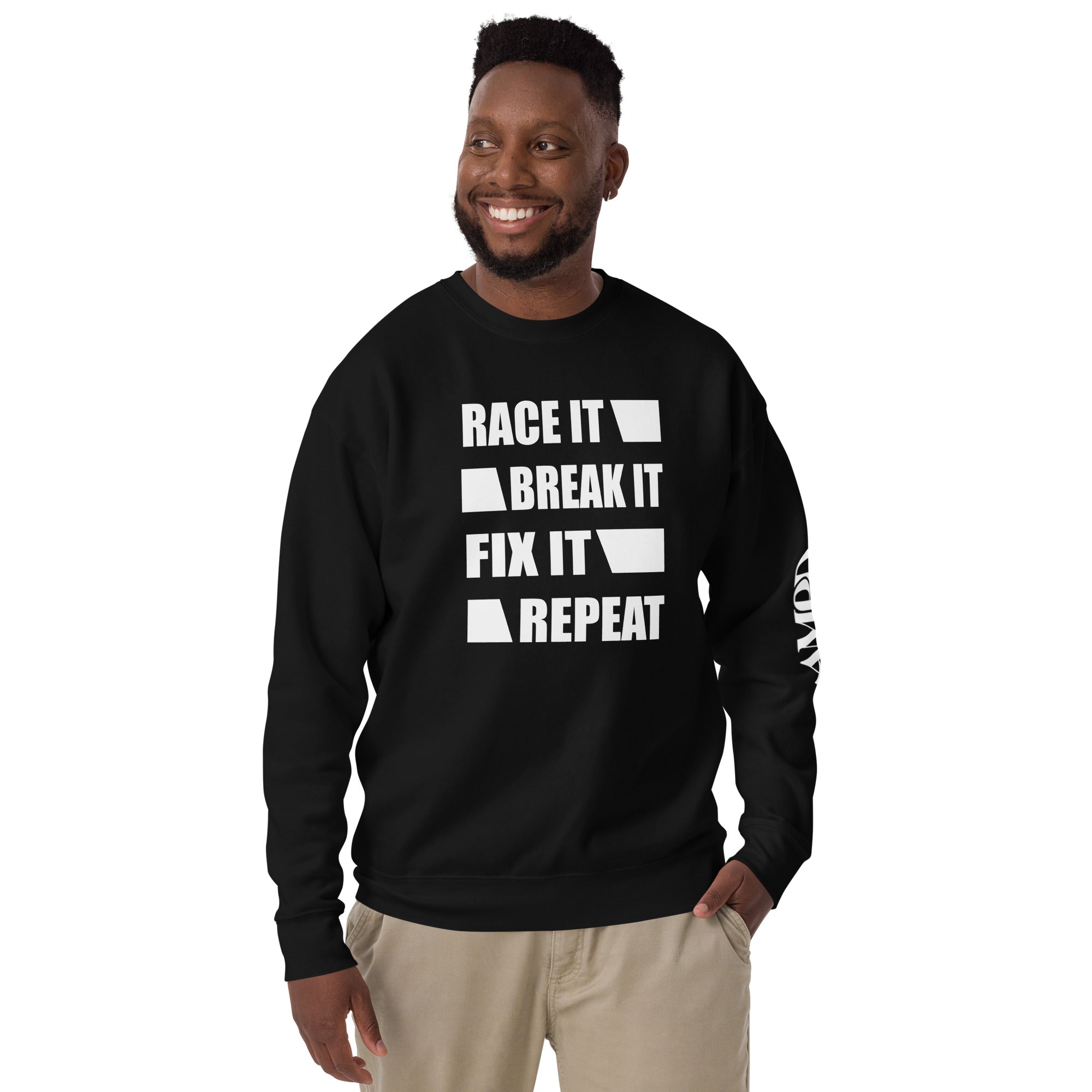 Man wearing Race It Break It Fix It Repeat Sweatshirt | AMPD in black with bold white text design