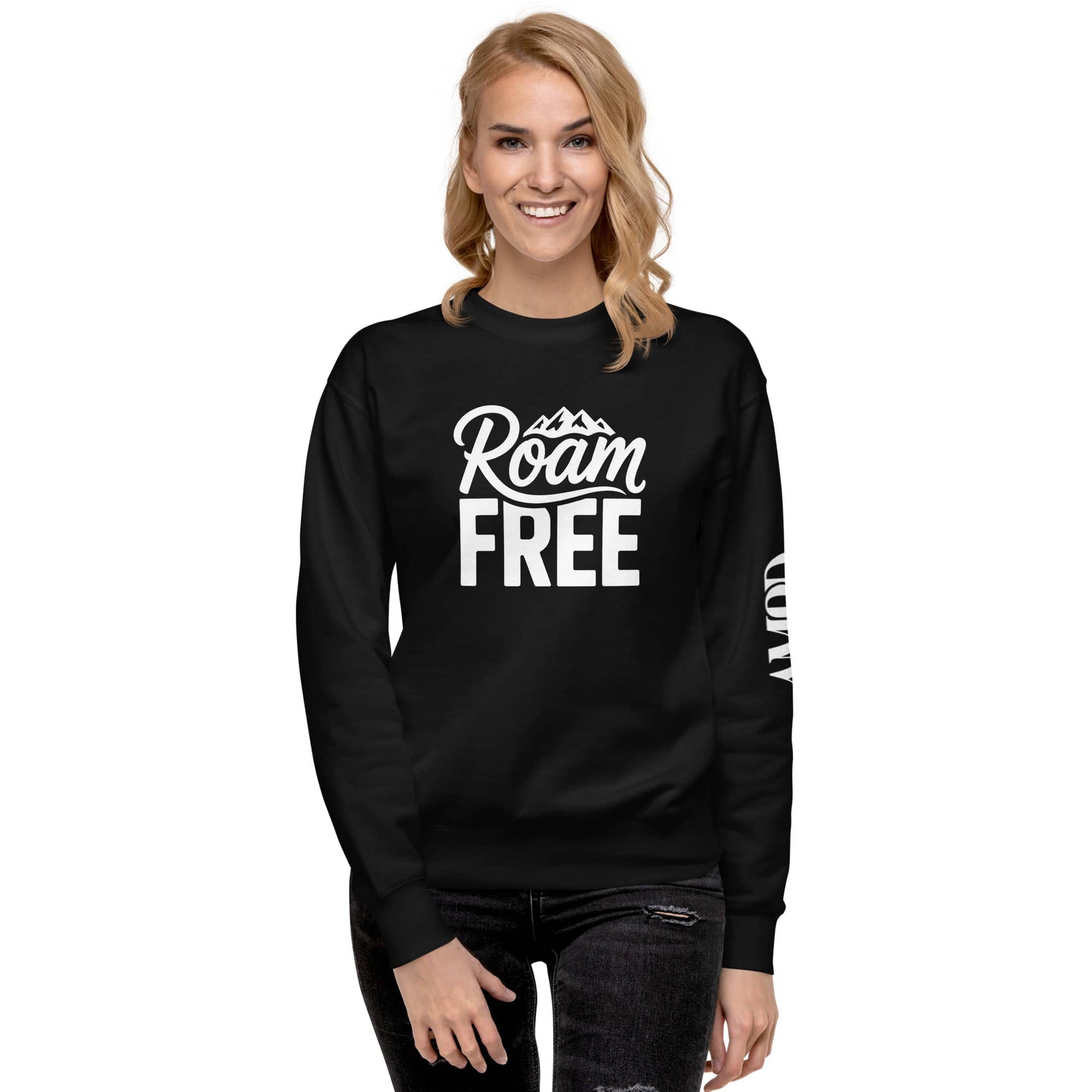 Woman wearing black Roam Free Sweatshirt Outdoor Explorer Tee for Hikers, Travelers & Wanderers with mountain graphic