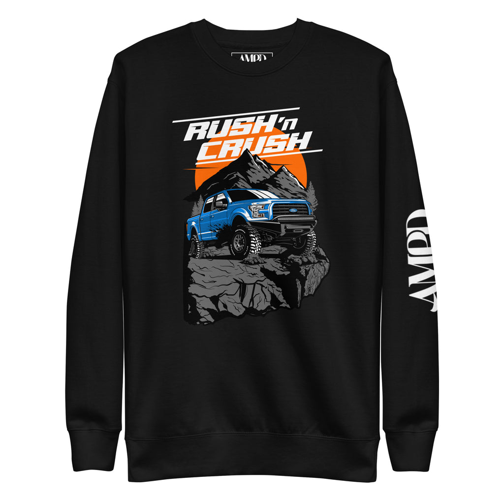 Rush n' Crush Off-Road Sweatshirt | AMPD featuring a blue truck on a rocky terrain with mountain backdrop