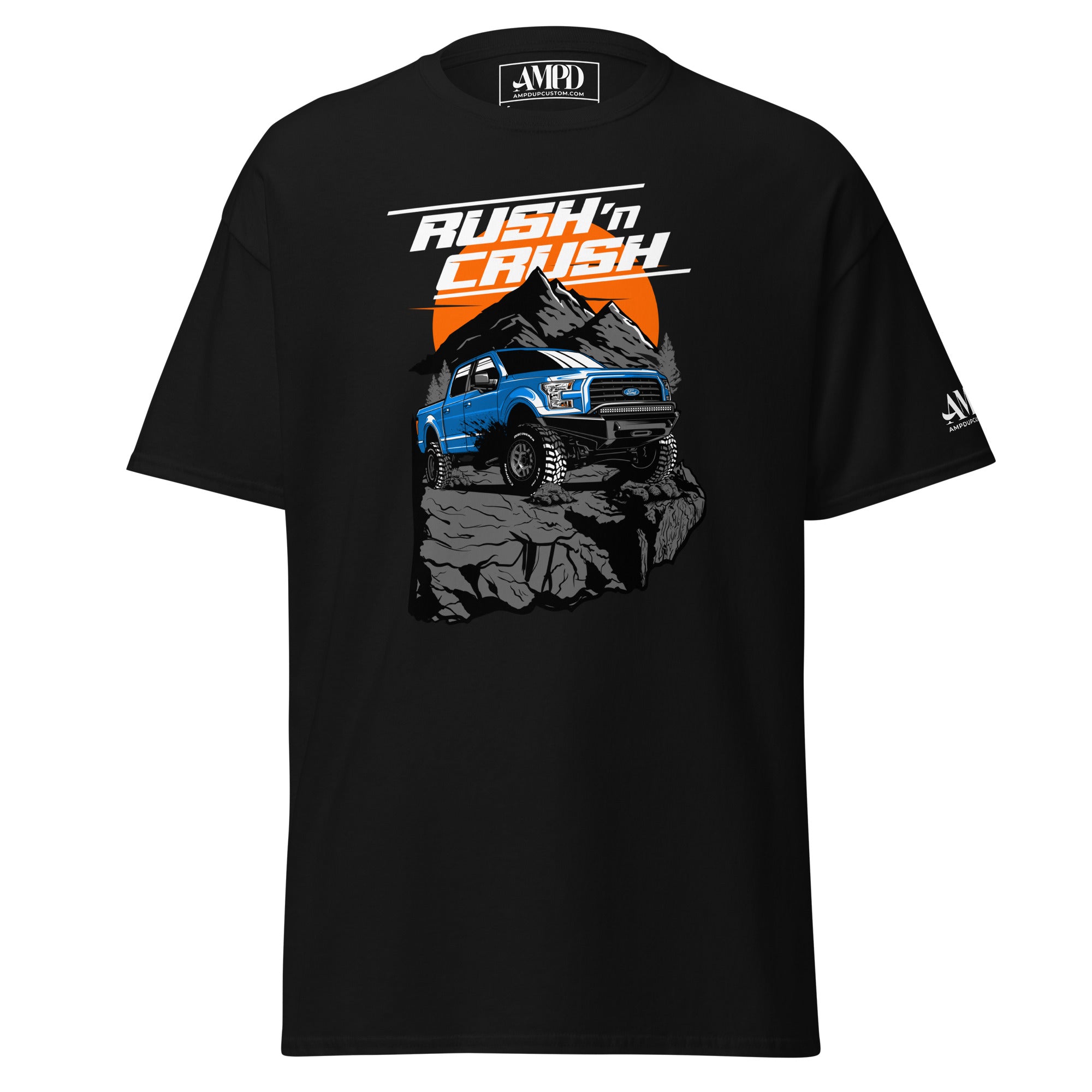 Rush n Crush Off-Road T-Shirt | AMPD featuring bold graphics of a blue truck on a rock mountain