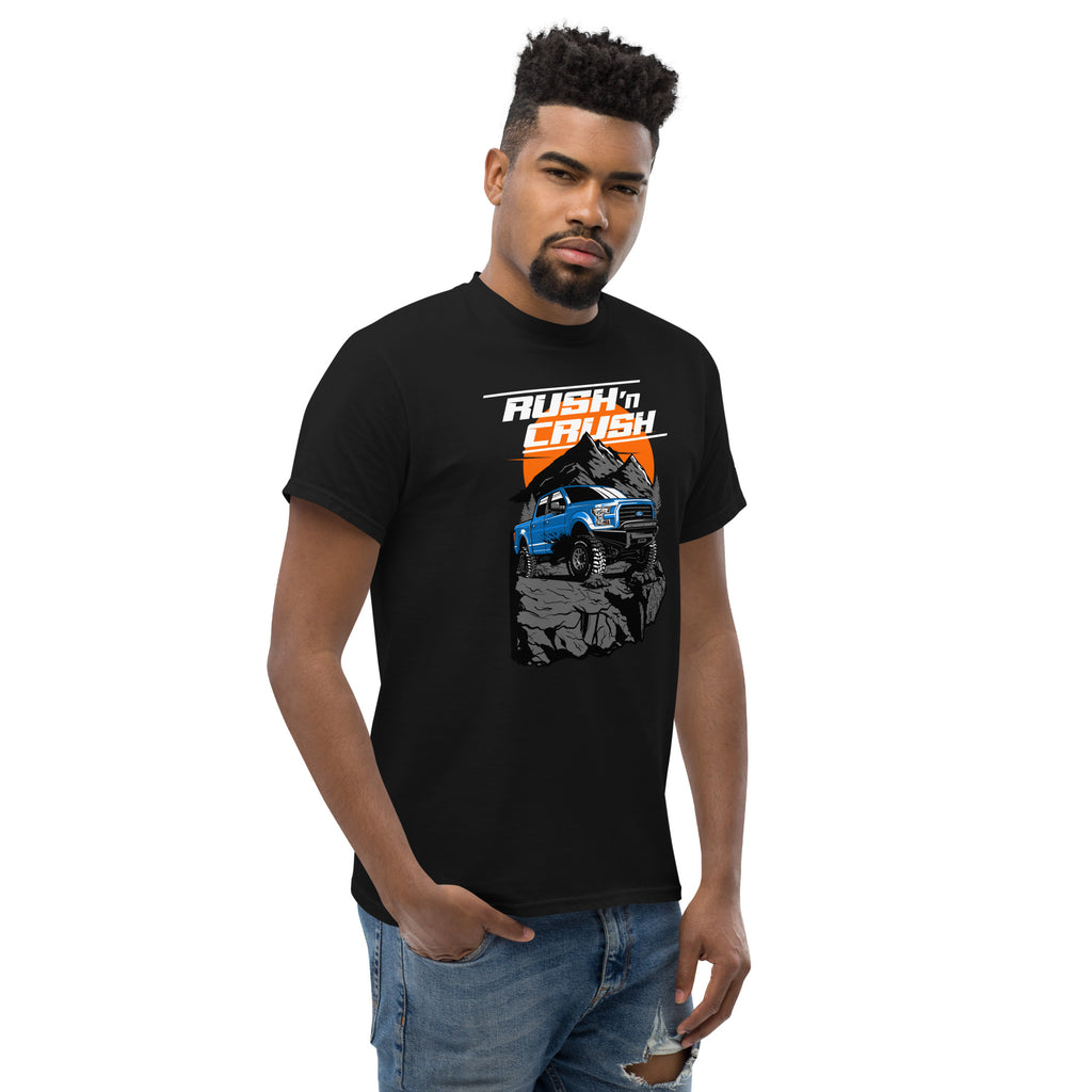 Rush n Crush Off-Road T-Shirt | AMPD featuring a graphic of a blue truck on a rocky terrain