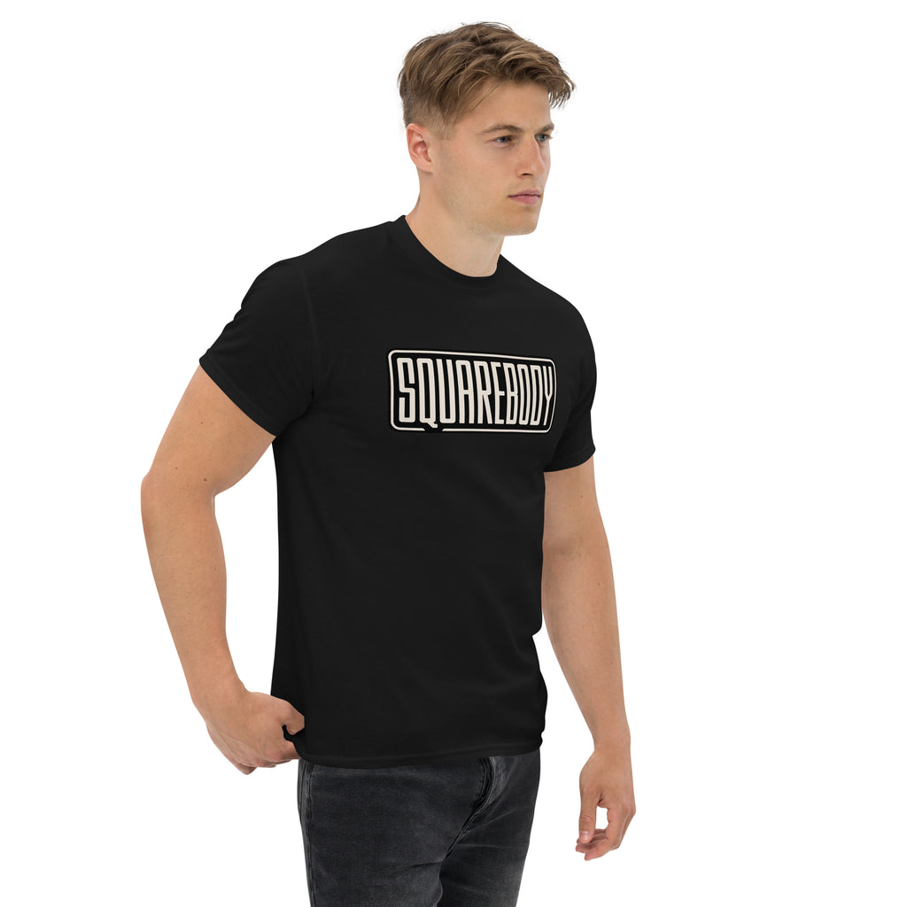 Squarebody Graphic T-Shirt | AMPD in black worn by a male model standing confidently