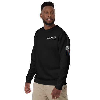 Male model wearing black crewneck Amp'd Up Custom Classic Sweatshirt with white chest logo and thin blue line flag sleeve patch