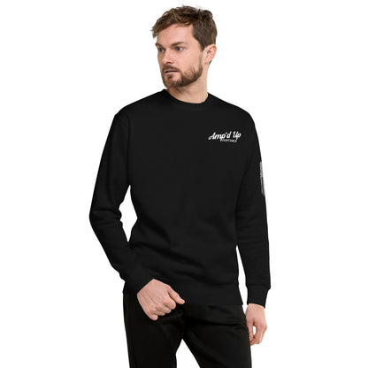 Male model wearing black Amp'd Up Custom Classic Sweatshirt with white chest logo and long sleeves