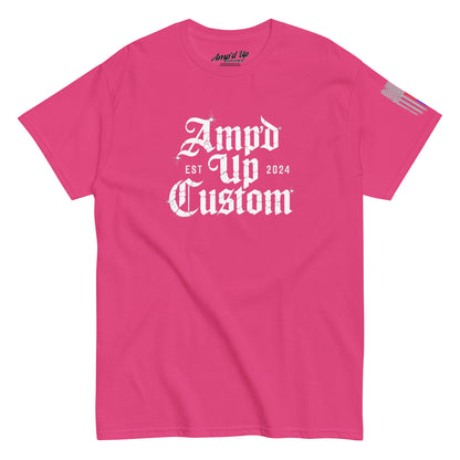 Bright pink crewneck Amp'd Up Custom EST2024 T-Shirt with white gothic front logo and small American flag on sleeve