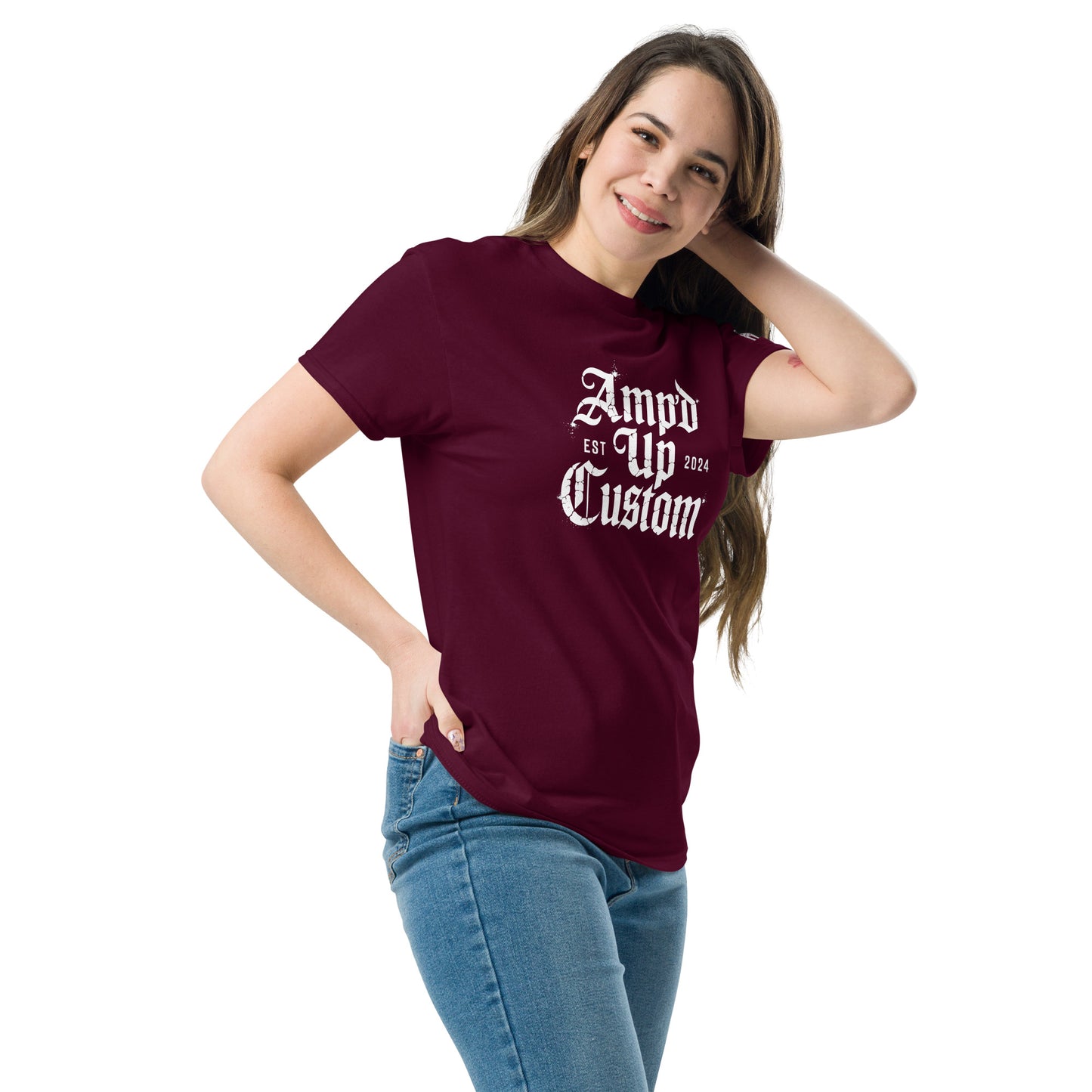 Woman wearing maroon Amp'd Up Custom EST2024 T-Shirt with white gothic logo casual fit jeans