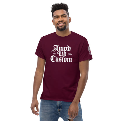 Burgundy men's T-shirt with white gothic logo and flag sleeve worn by smiling model Amp'd Up Custom EST2024 T-Shirt