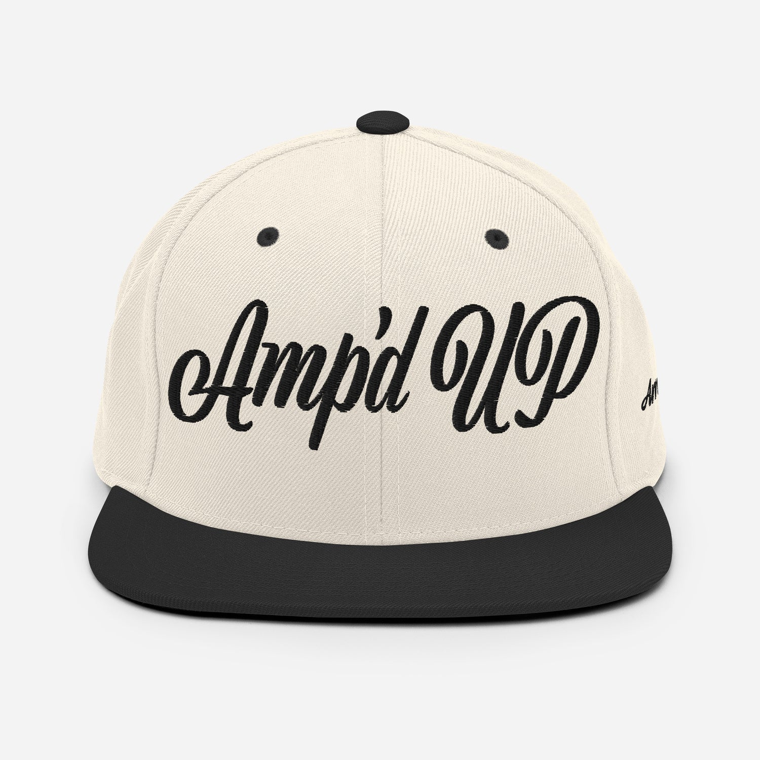 Amp'd Up cursive 3D Puff Snapback Hat in cream and black with stylish embroidered logo