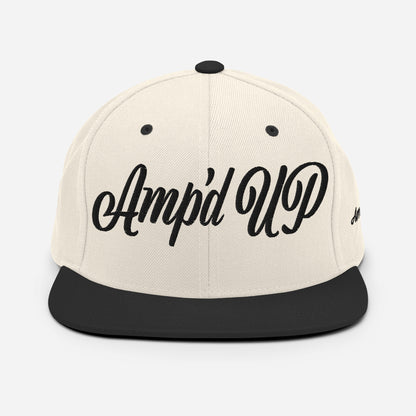 Amp'd Up cursive 3D Puff Snapback Hat in cream and black with stylish embroidered logo