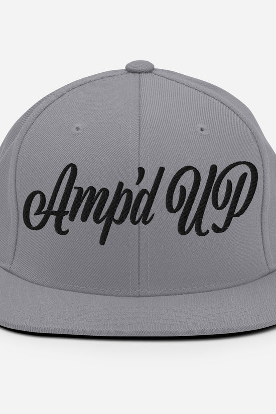 Amp'd Up cursive 3D Puff Snapback Hat in grey with bold black lettering for stylish wear