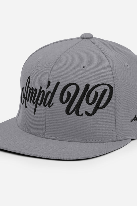 Gray Amp'd Up cursive 3D Puff Snapback Hat with a stylish design for casual wear