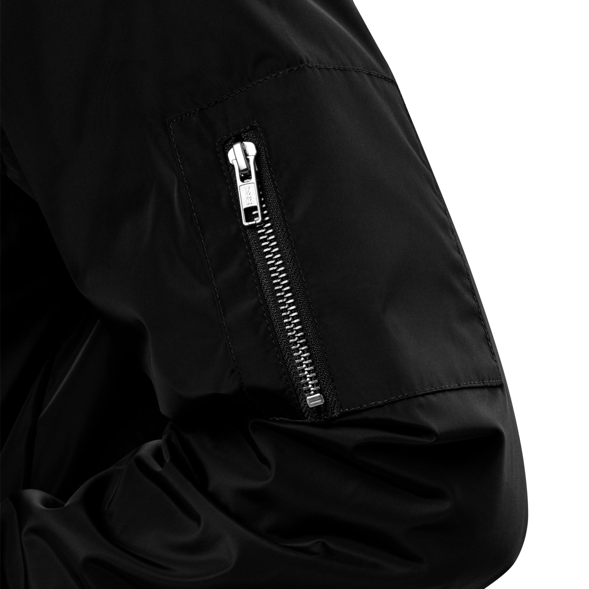 Close-up of Ampd Up Custom Premium recycled bomber jacket showcasing zipper detail on the sleeve