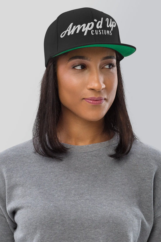 Amp'd Up Custom Snapback Hat in black with stylish logo, perfect for casual wear