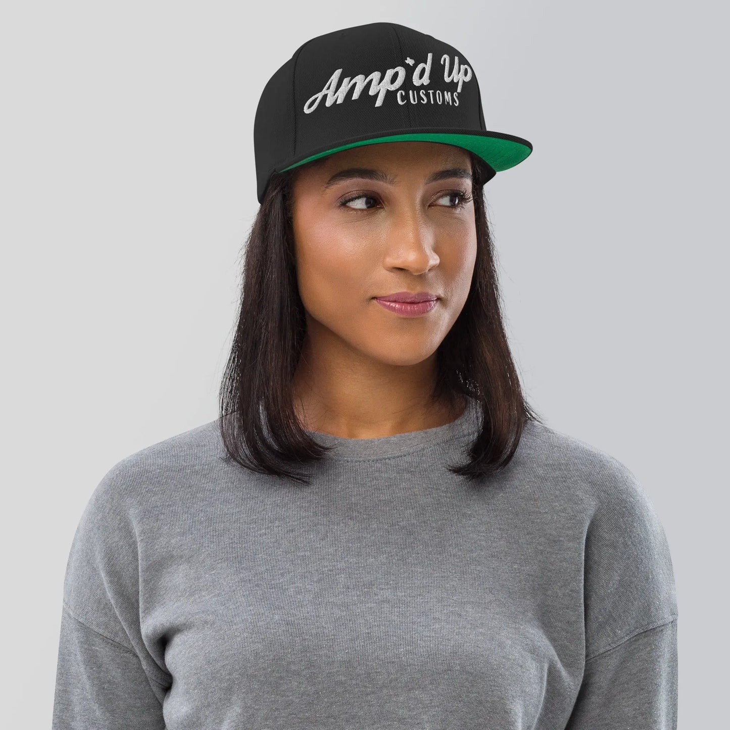 Amp'd Up Custom Snapback Hat in black with stylish logo, perfect for casual wear