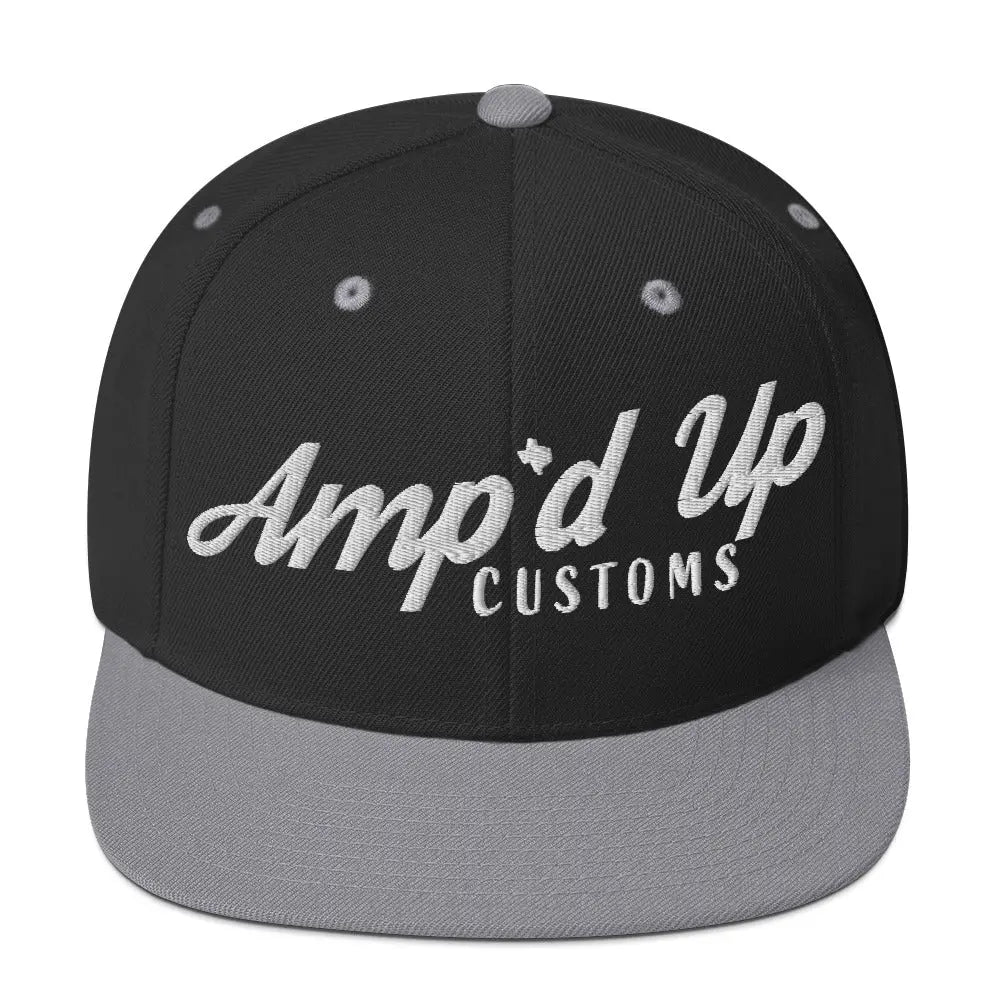Amp'd Up Custom Snapback Hat features a black body with gray brim and stylish embroidered logo