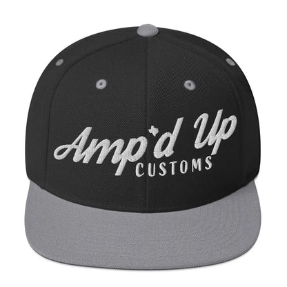 Amp'd Up Custom Snapback Hat features a black body with gray brim and stylish embroidered logo