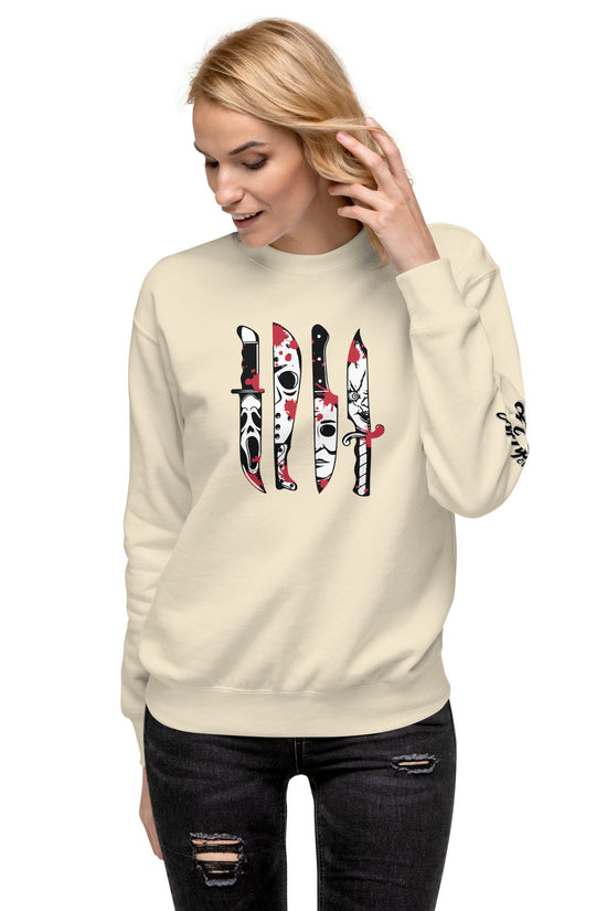Woman wearing Amp'd Up Custom beige Horror Movie Classic Knives Sweatshirt with knife graphic design