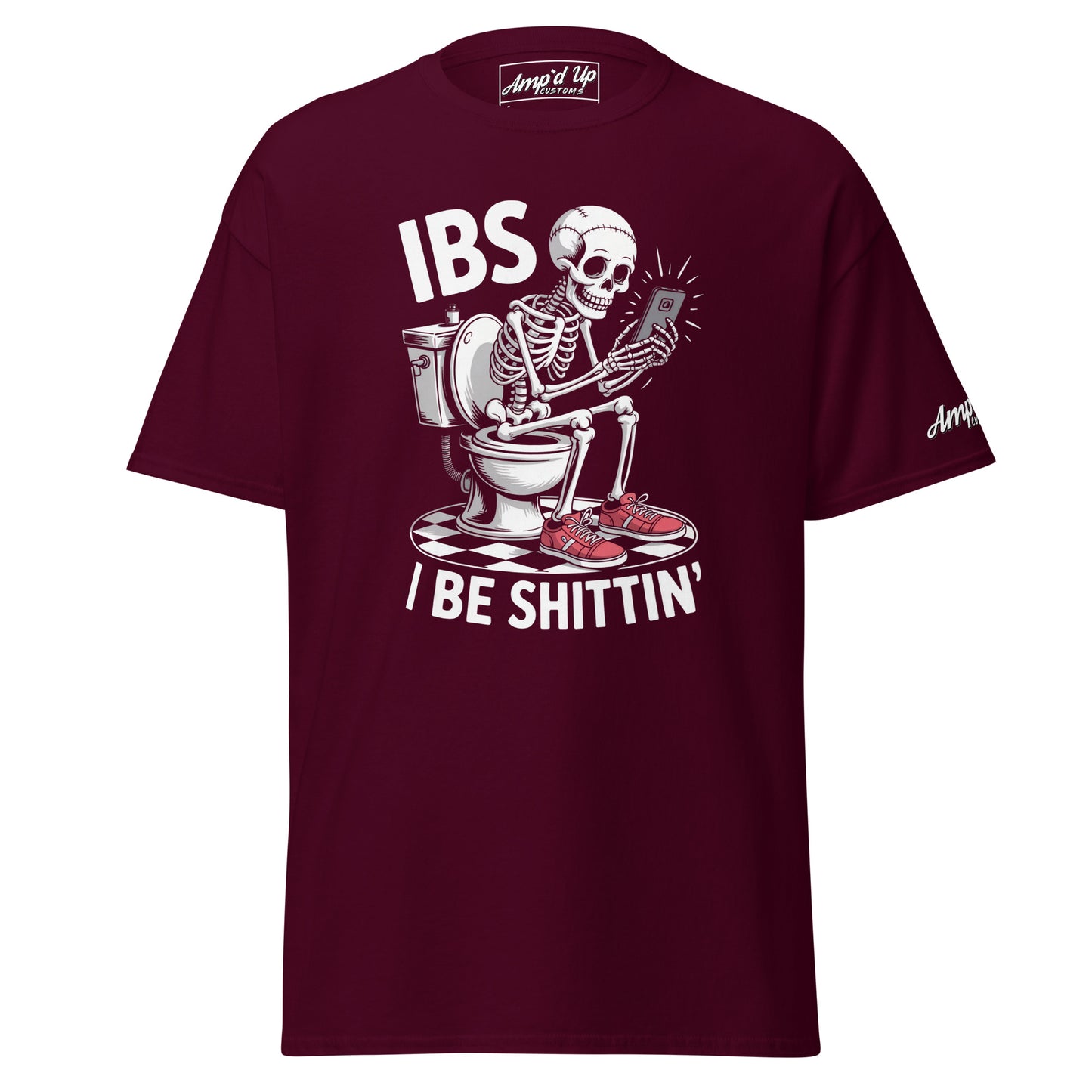 Maroon I Be Shittin T-Shirt featuring a skeleton sitting on a toilet with a phone