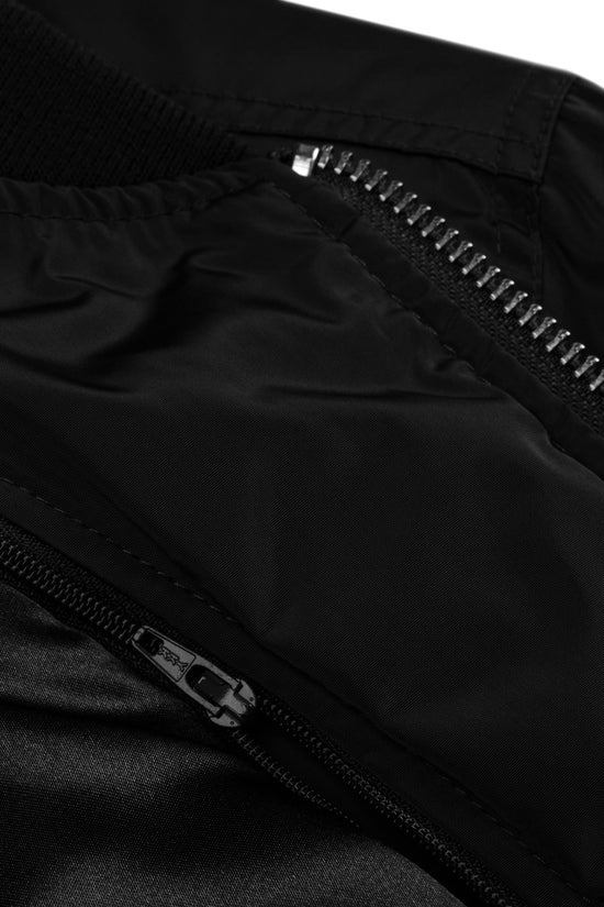Close-up of the Amp'd Up Premium recycled bomber jacket showcasing the detailed zipper and collar design
