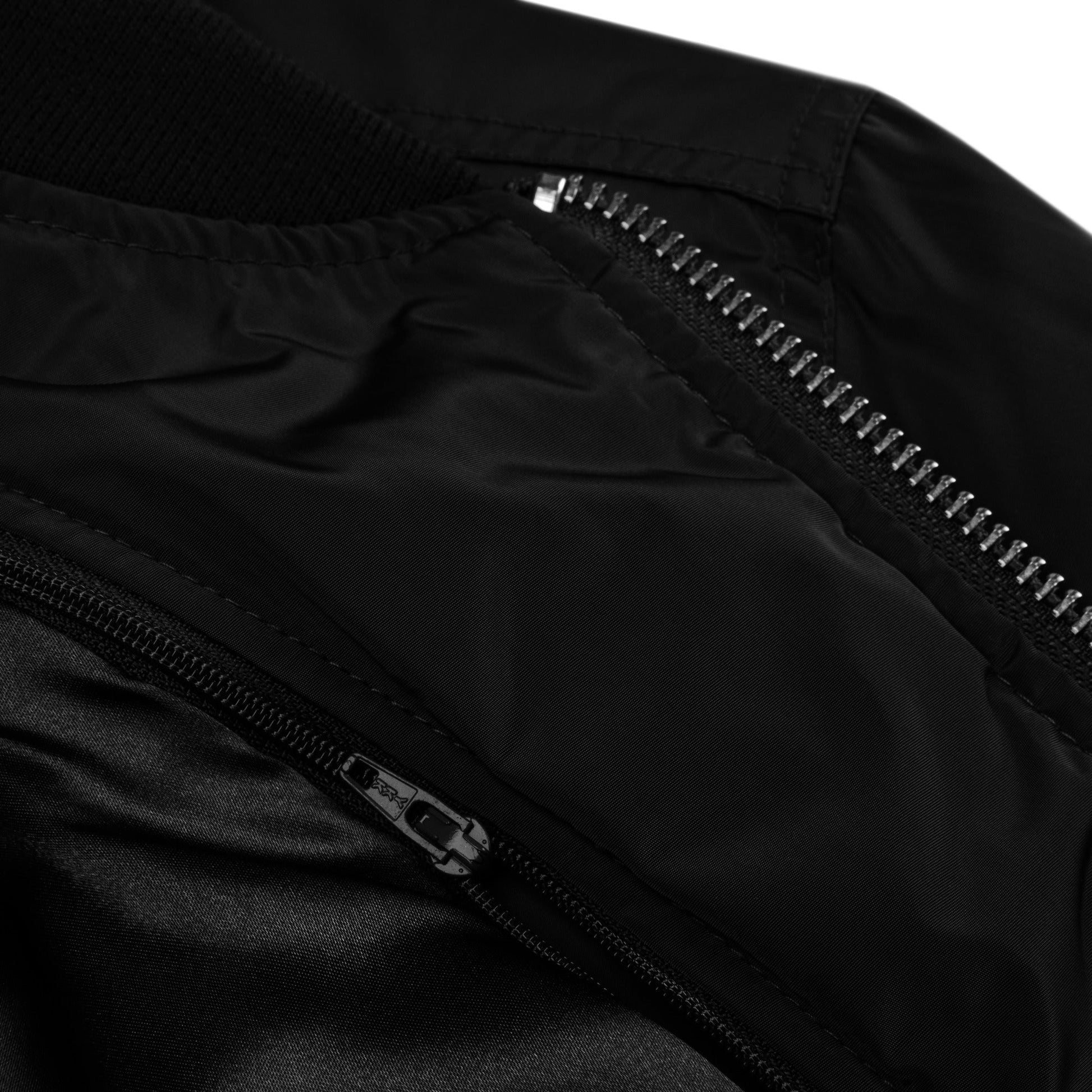 Close-up of the Amp'd Up Premium recycled bomber jacket showcasing the detailed zipper and collar design