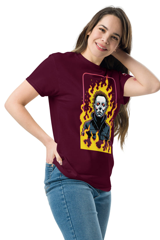 Woman wearing a burgundy Retro Jason T-Shirt with a graphic of a flaming Jason mask on the front