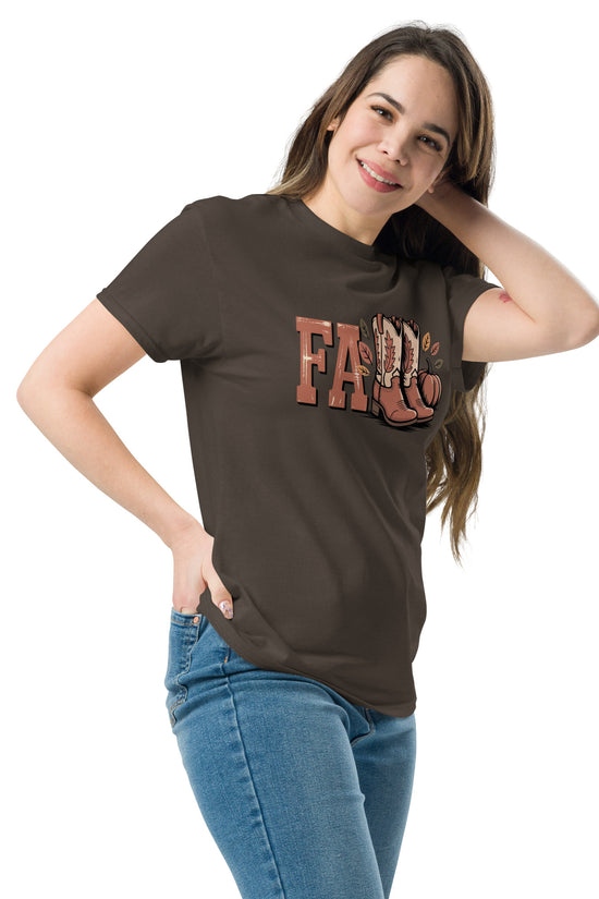 Woman wearing a brown Southern Fall T-Shirt with autumn-themed graphic and blue jeans