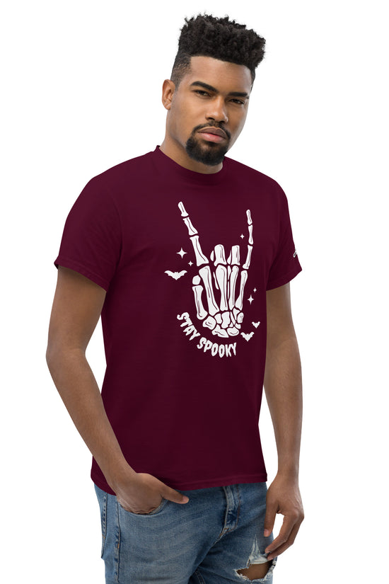Stay Spooky T-Shirt maroon with skeleton hand graphic worn by male model in jeans