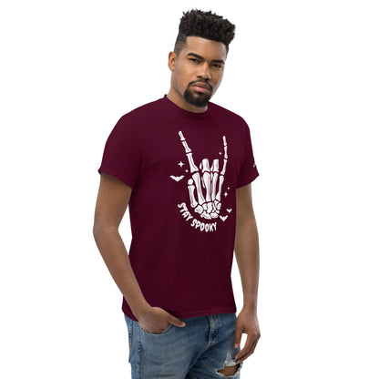 Stay Spooky T-Shirt maroon with skeleton hand graphic worn by male model in jeans