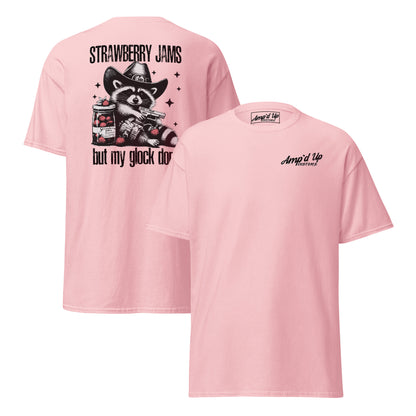 Pink T-shirt featuring Strawberry Jams, But My Glock Don't back illustration with a raccoon design