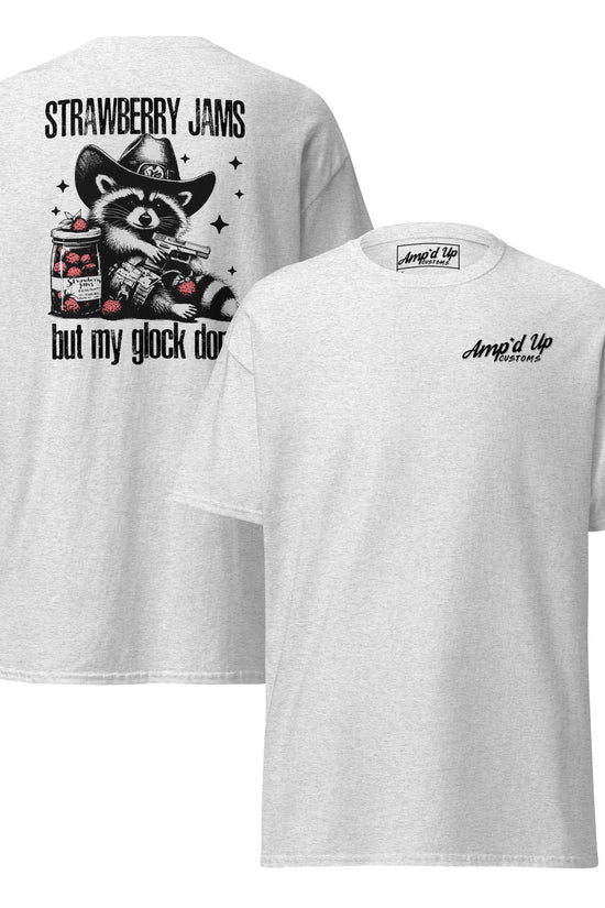 A white T-shirt featuring a back illustration of a raccoon with the text Strawberry Jams, But My Glock Don't