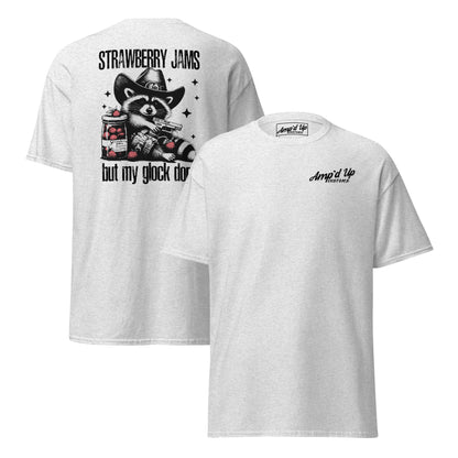 A white T-shirt featuring a back illustration of a raccoon with the text Strawberry Jams, But My Glock Don't