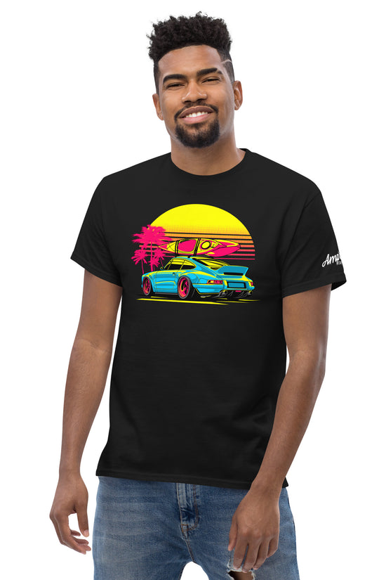 Amp'd Up Custom Sunset Porsche T-Shirt featuring vibrant car graphic against a sunset backdrop