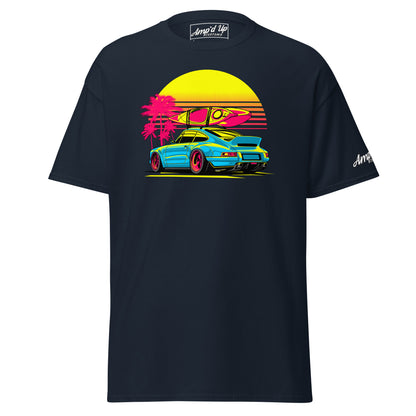 Amp'd Up Custom Sunset Porsche T-Shirt featuring a vibrant design of a car with surfboards and palm trees