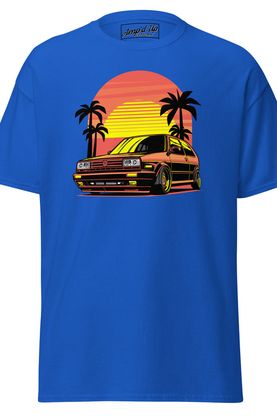 Amp'd Up Custom Sunset Volkswagen T-Shirt in blue featuring a retro car and palm trees