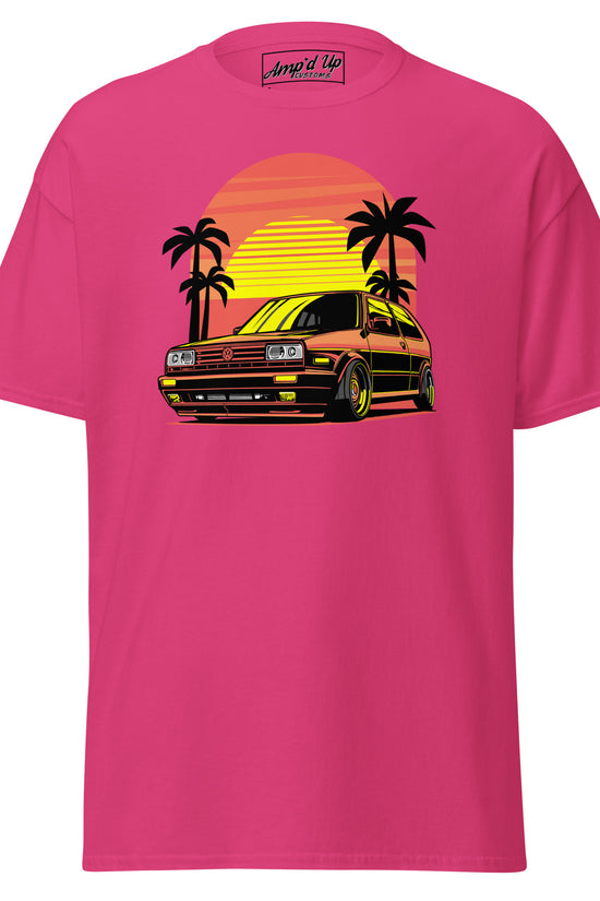 Amp'd Up Custom Sunset Volkswagen T-Shirt in pink with graphic of a car and palm trees