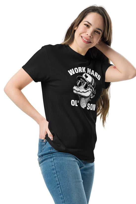 Woman wearing black Work Hard Ol' Son T-Shirt with graphic design and casual blue jeans