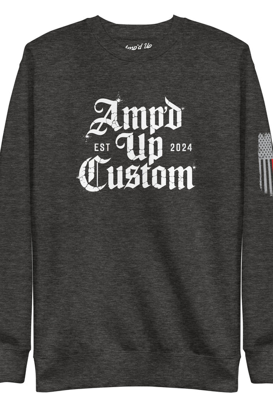 Dark charcoal crewneck sweatshirt with white gothic logo front and thin line flag sleeve detail Amp'd Up Custom EST2024 Sweatshirt