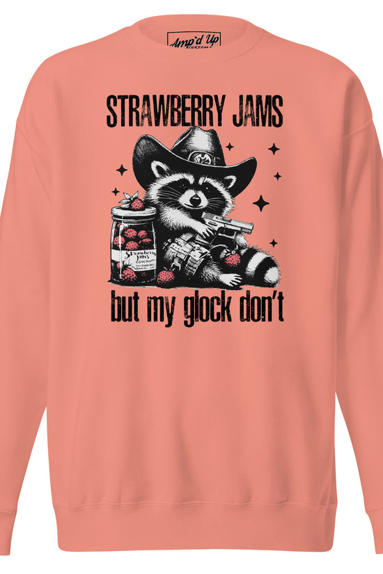 Amp'd Up Custom Strawberry Jams, But My Glock Don't Sweatshirt featuring a raccoon graphic and vibrant coral color