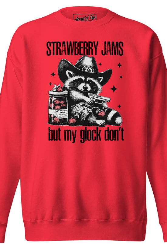 Bold red sweatshirt featuring 'Strawberry Jams, But My Glock Don't' with raccoon graphic