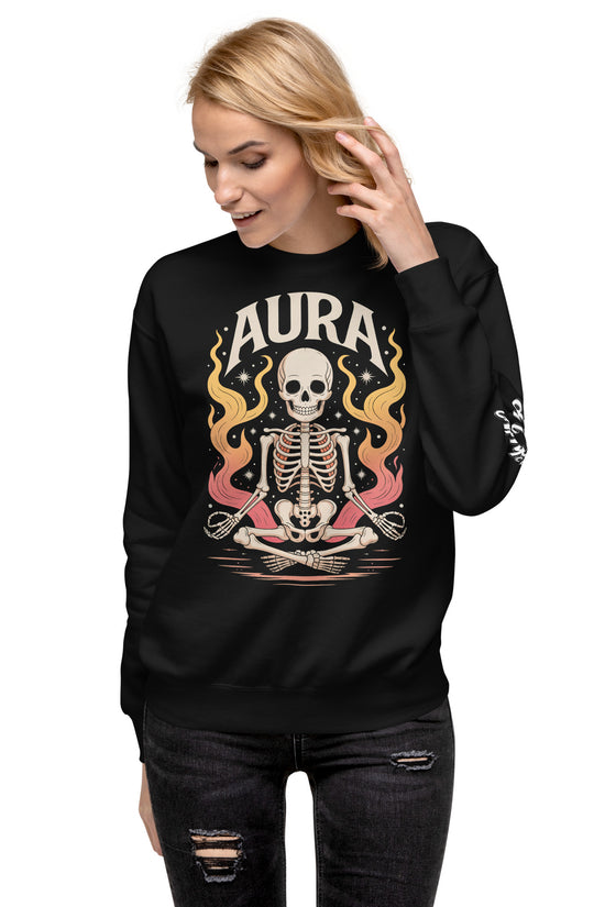 Black AURA Sweatshirt with skeleton and flame design worn by woman in ripped black jeans