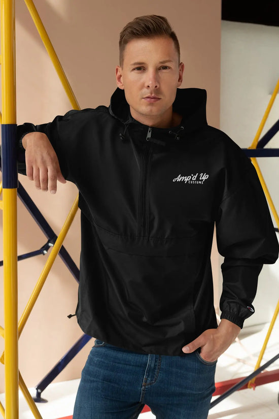Amp'd Up Embroidered Champion Packable Jacket on a model in a stylish urban setting
