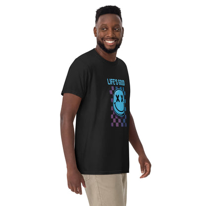 Man wearing a Life's Good Smiley Face Checkered T-Shirt in black with colorful graphic design