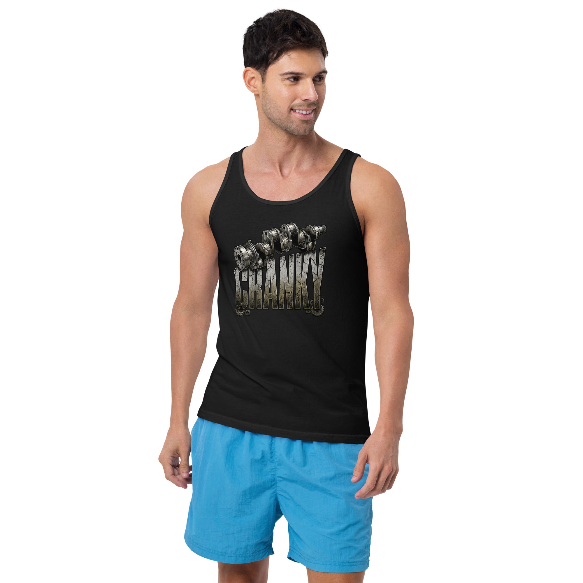 Man wearing a black tank top with a graphic design and blue shorts on a white background