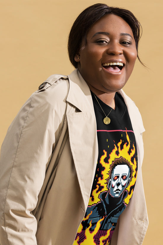 Woman wearing Retro Jason Sweatshirt with flaming skull graphic under beige trench coat smiling
