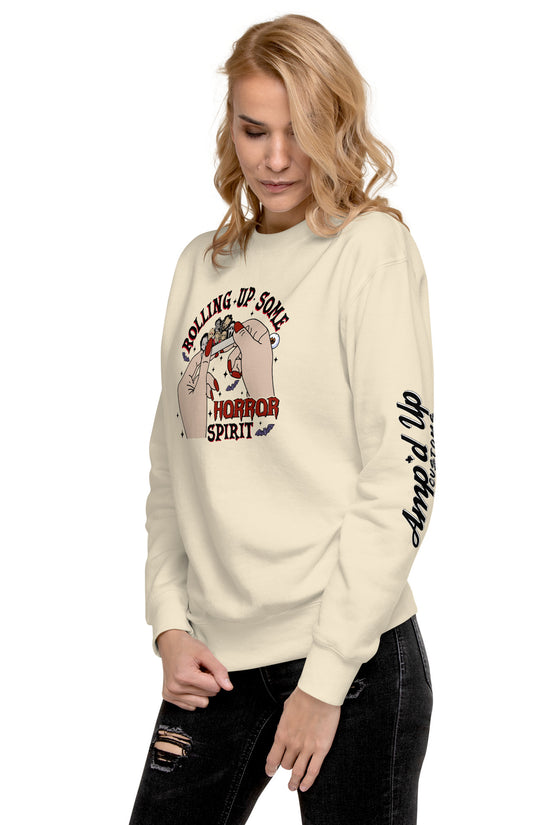 Amp'd Up Custom Rolling Up Some Horror Spirit Sweatshirt worn by woman in beige with black jeans