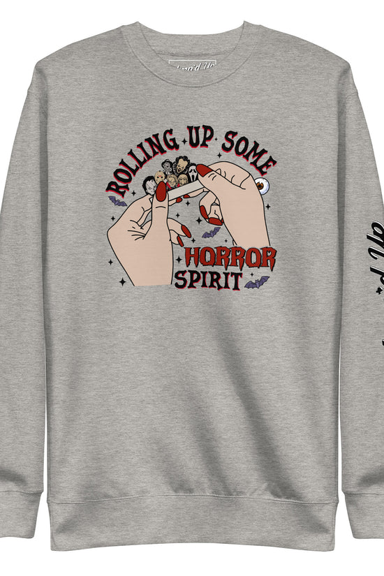 Gray sweatshirt featuring Rolling Up Some Horror Spirit Sweatshirt graphic with hands rolling a joint and Amp'd Up logo on sleeve