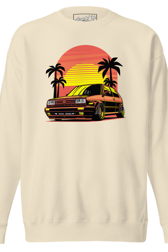 Cream Sunset Volkswagen Sweatshirt featuring a retro car and palm trees against a sunset backdrop